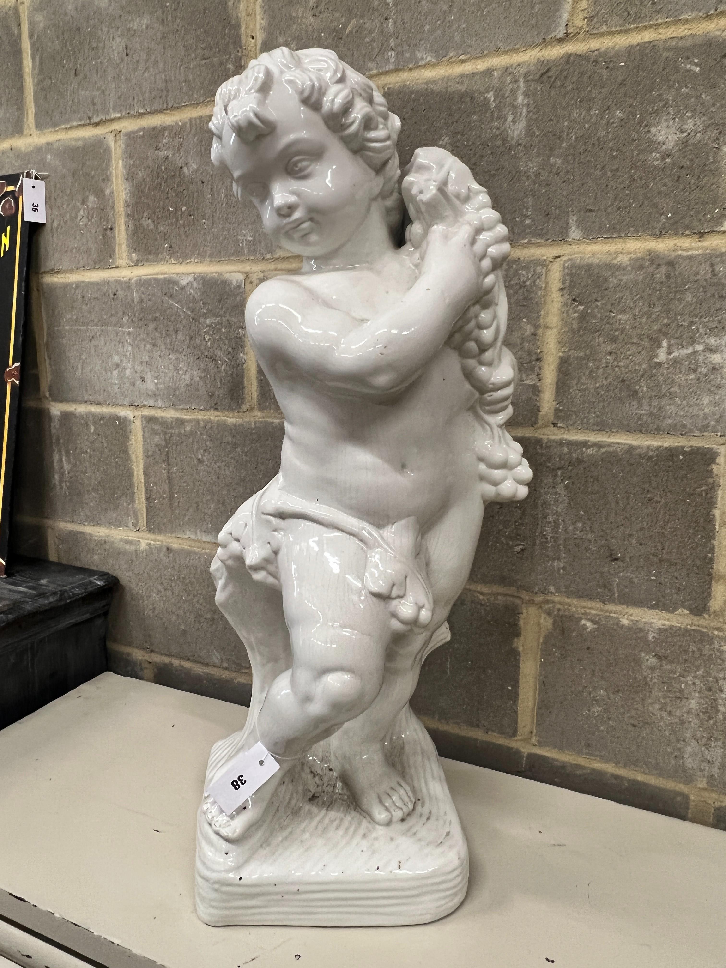 A glazed earthenware cherub ornament, height 87cm